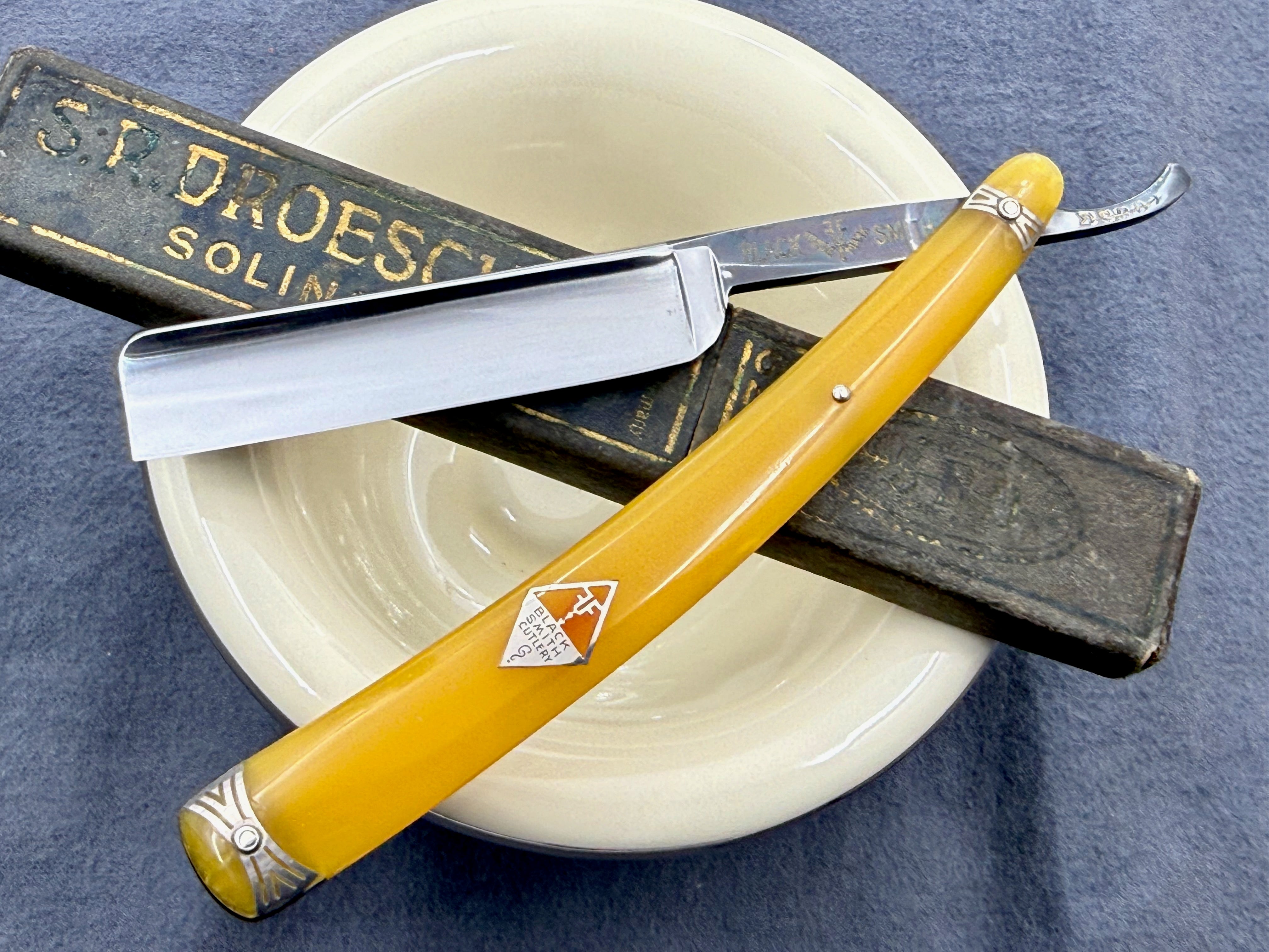 A vintage boxed Solingen 7 Week Day straight razor set A vintage boxed Solingen 7 Week Day straight razor set